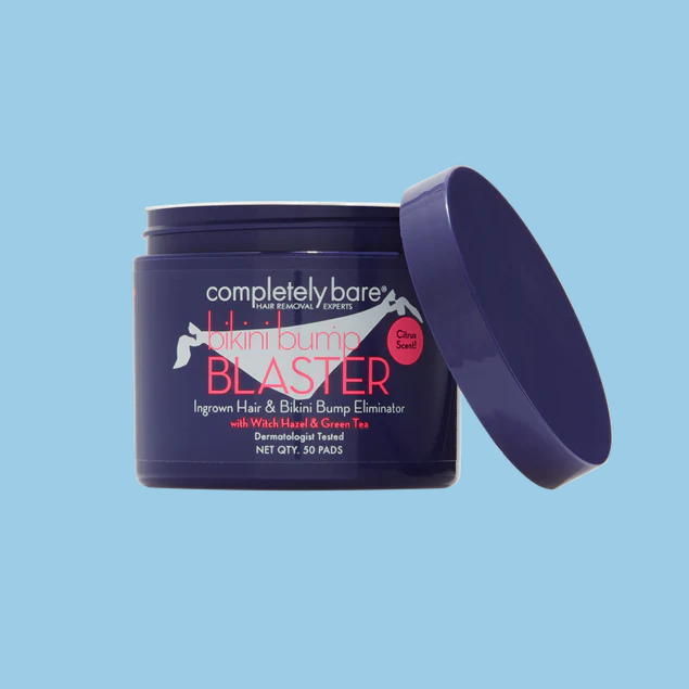 A purple jar of Completely Bare Bikini Bump Blaster pads with the lid open against a blue background.