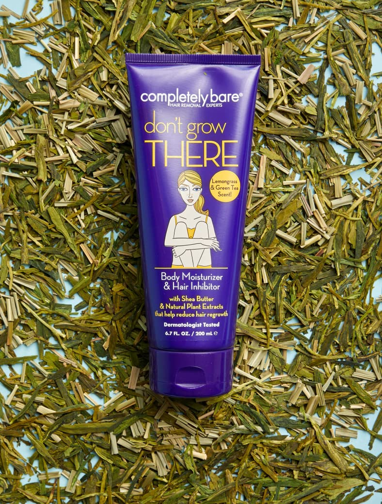 A purple tube of Completely Bare Don't Grow There body moisturizer on a bed of lemongrass and green tea.