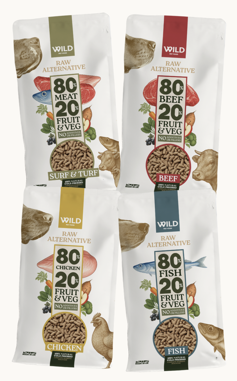 Four bags of pet food with different meat and vegetable blends.