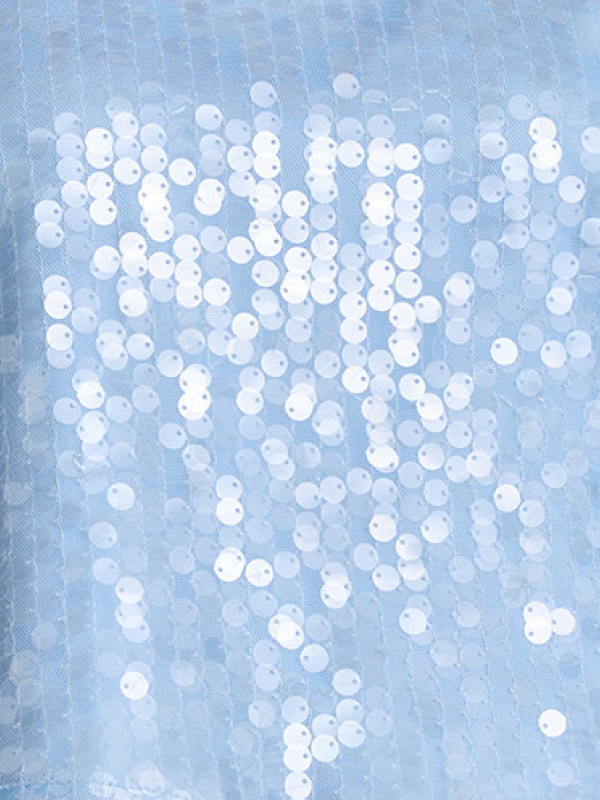 Close-up of light blue fabric with white sequins.
