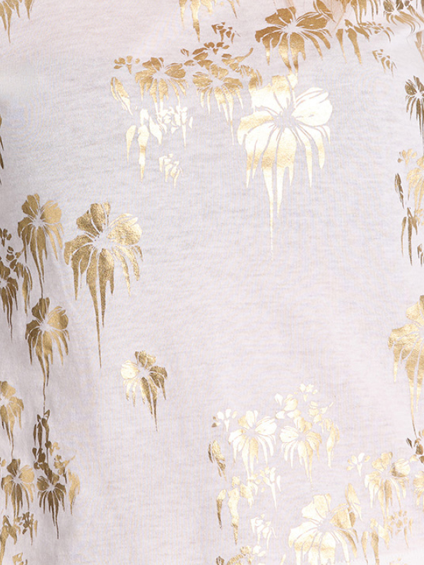 White fabric with gold floral pattern.