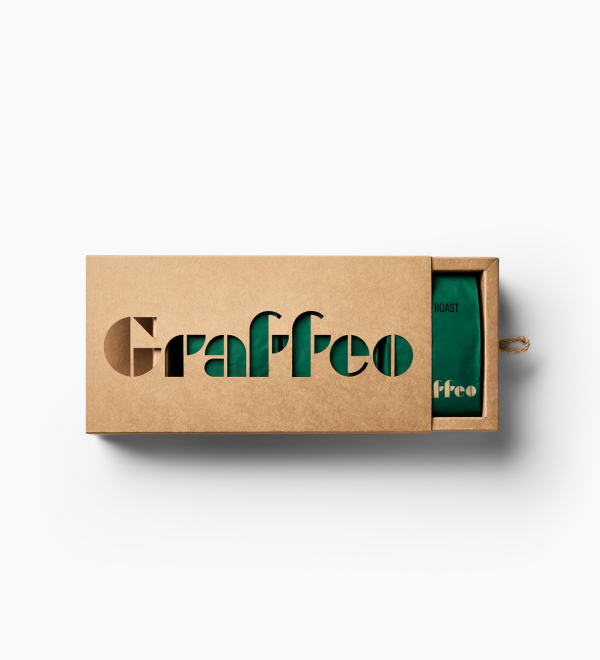 A cardboard sleeve with the word 'Graffeo' cut out, revealing a green bag inside.