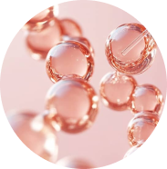 Cluster of transparent bubbles on a pink background.