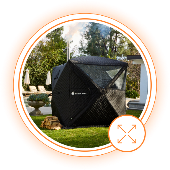 Outdoor black sauna tent set up in a sunny backyard.
