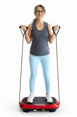A woman exercises on a red vibration plate machine with resistance bands against a white background.