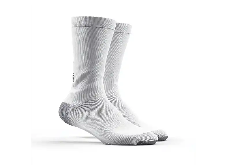 A pair of white ribbed crew socks with grey heels and toes against a white background.