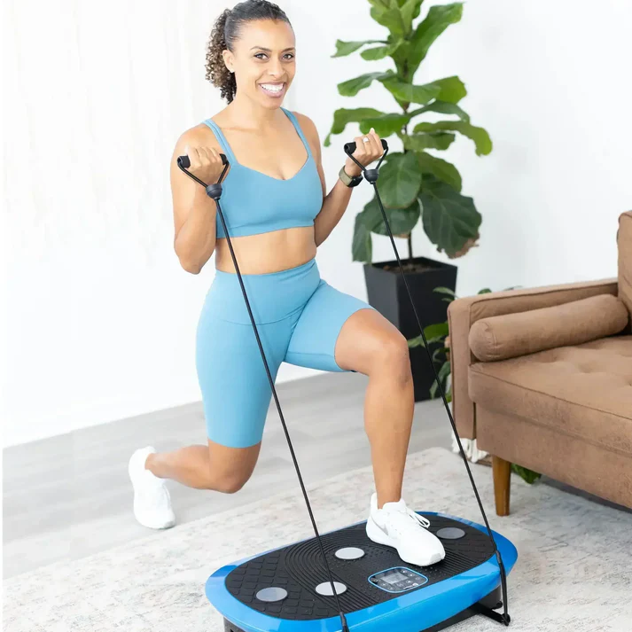 Person exercising with resistance bands on a vibration platform indoors.