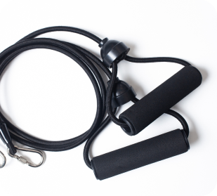 A black resistance band with foam handles and a metal clip, coiled on a white background.
