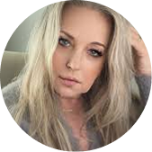 A circular headshot of a woman with long, blonde hair looking at the camera.