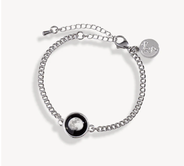 Silver bracelet with moon design and adjustable chain.