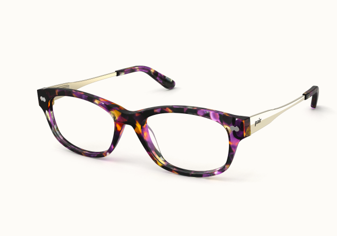 A pair of eyeglasses with purple and orange tortoiseshell frames and gold-colored arms, shown at an angle.