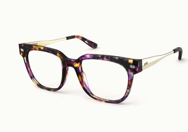 A pair of square eyeglasses with a purple, black, and yellow tortoiseshell frame and gold arms.