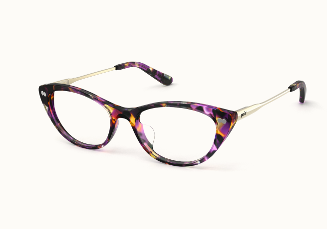 A pair of cat-eye glasses with a purple and amber tortoiseshell frame and gold temples.