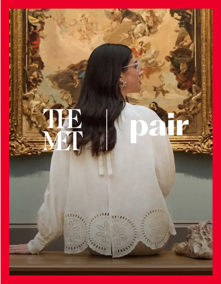 Person in front of a painting wearing a white blouse, text overlayed, red border.