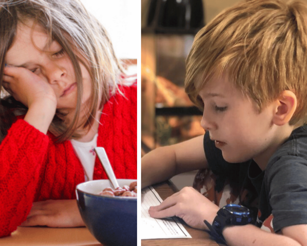 Two children; one sleeping at a table, the other reading a paper.