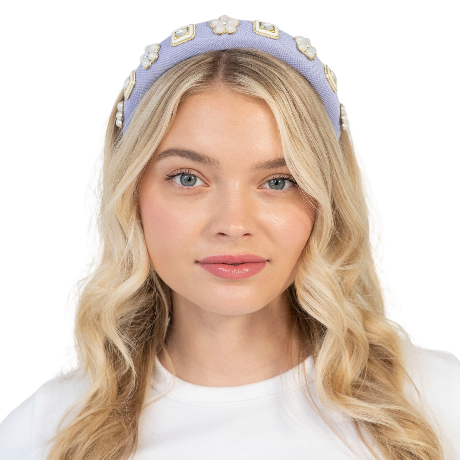 Blonde woman wearing a  lavender padded headband with gemstones