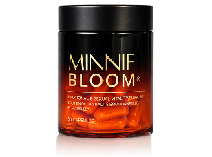 A dark glass bottle with a black lid, filled with orange capsules, labeled Minnie Bloom.