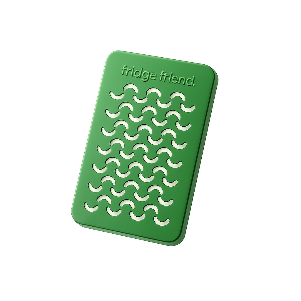 A close-up of a green, rectangular object with the words 'fridge friend' and crescent-shaped cutouts.