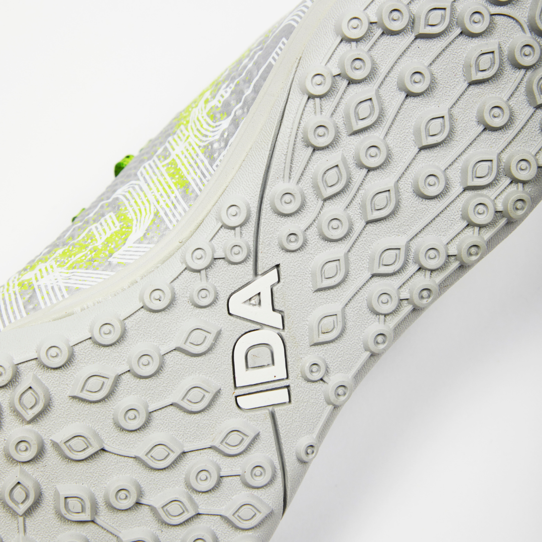 Close-up of a shoe sole with textured grip and the word 'IDA'.