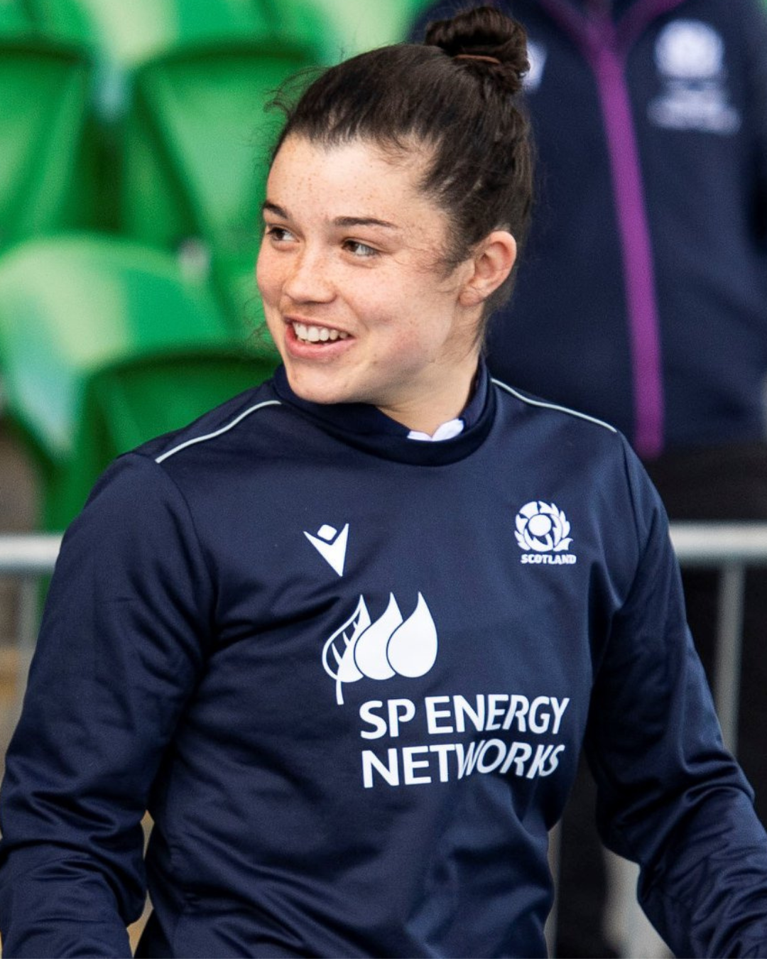 A person smiling in a dark sports jersey with 'SP Energy Networks' logo.