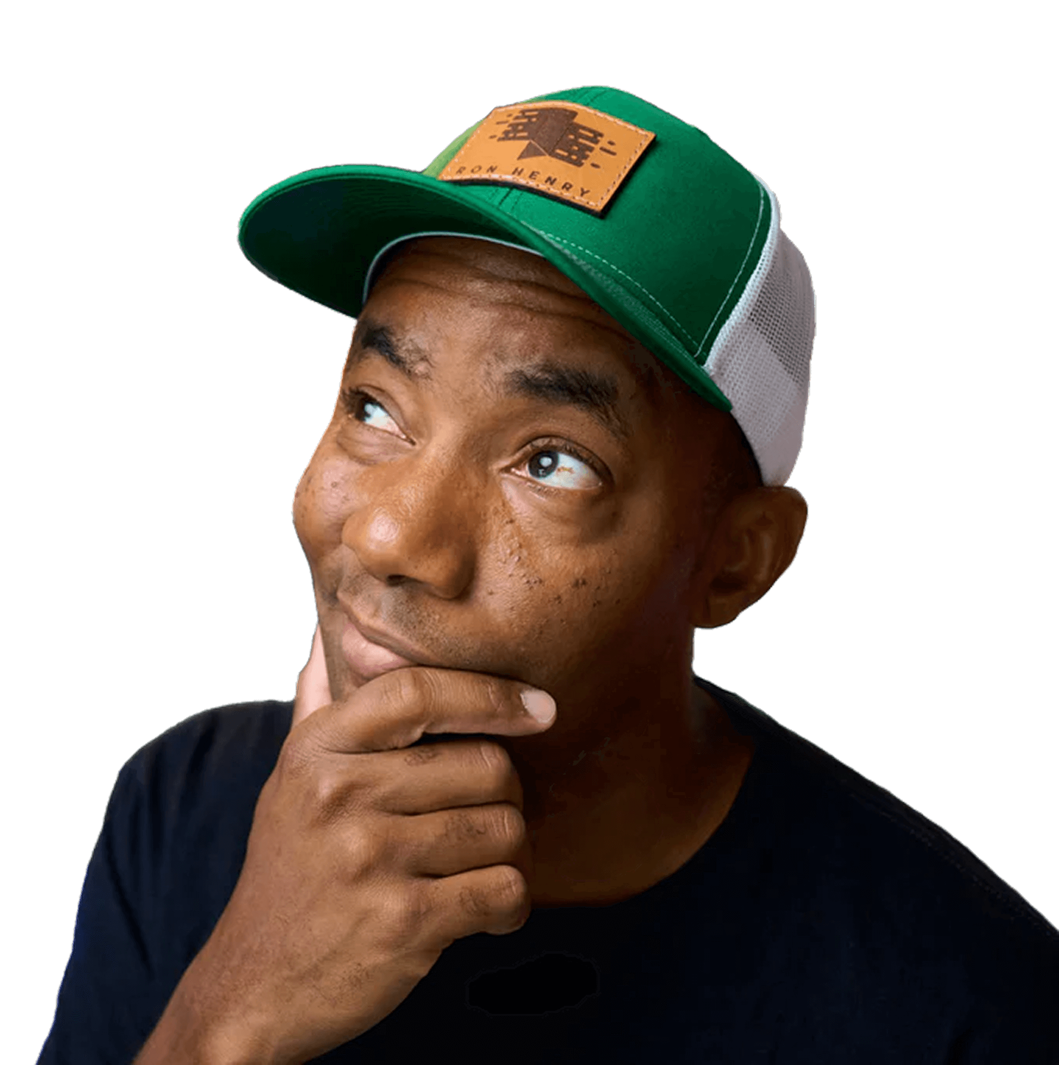 man wearing a hat looking up to left with hand on chin