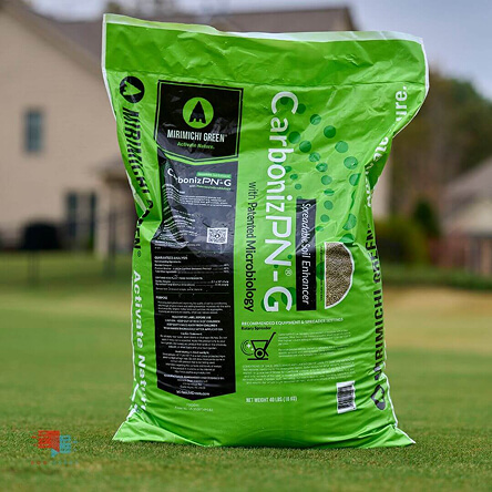 Green bag of CarbonizPN soil enhancer on grass.