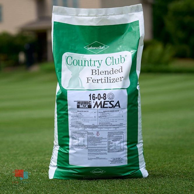Bag of Country Club Blended Fertilizer on grass.