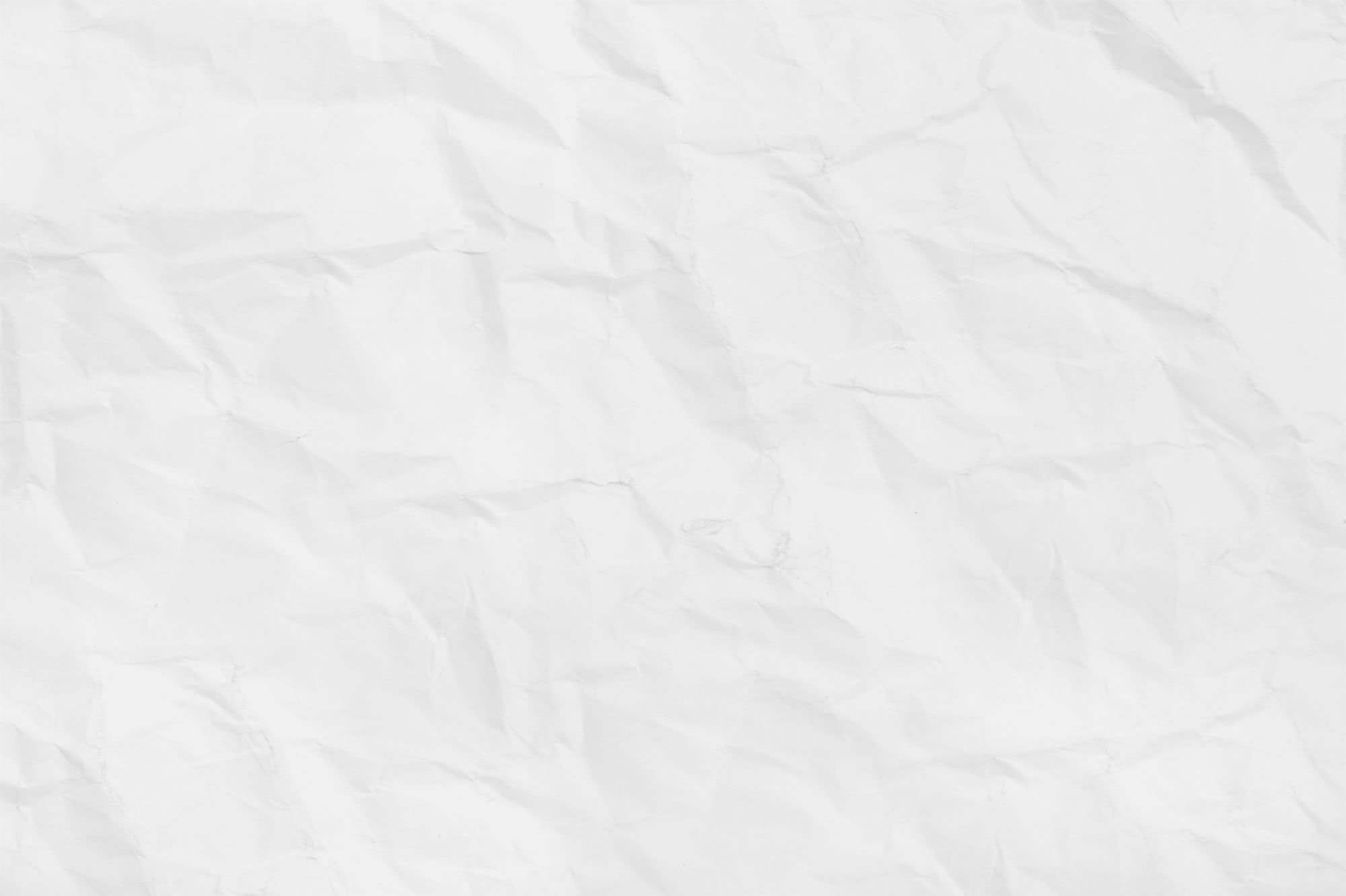 A crumpled white paper texture with visible folds and creases.