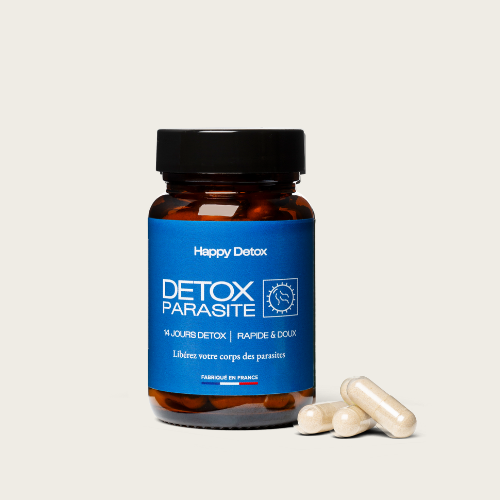 Brown bottle labeled 'Detox Parasite' with three white capsules beside it.