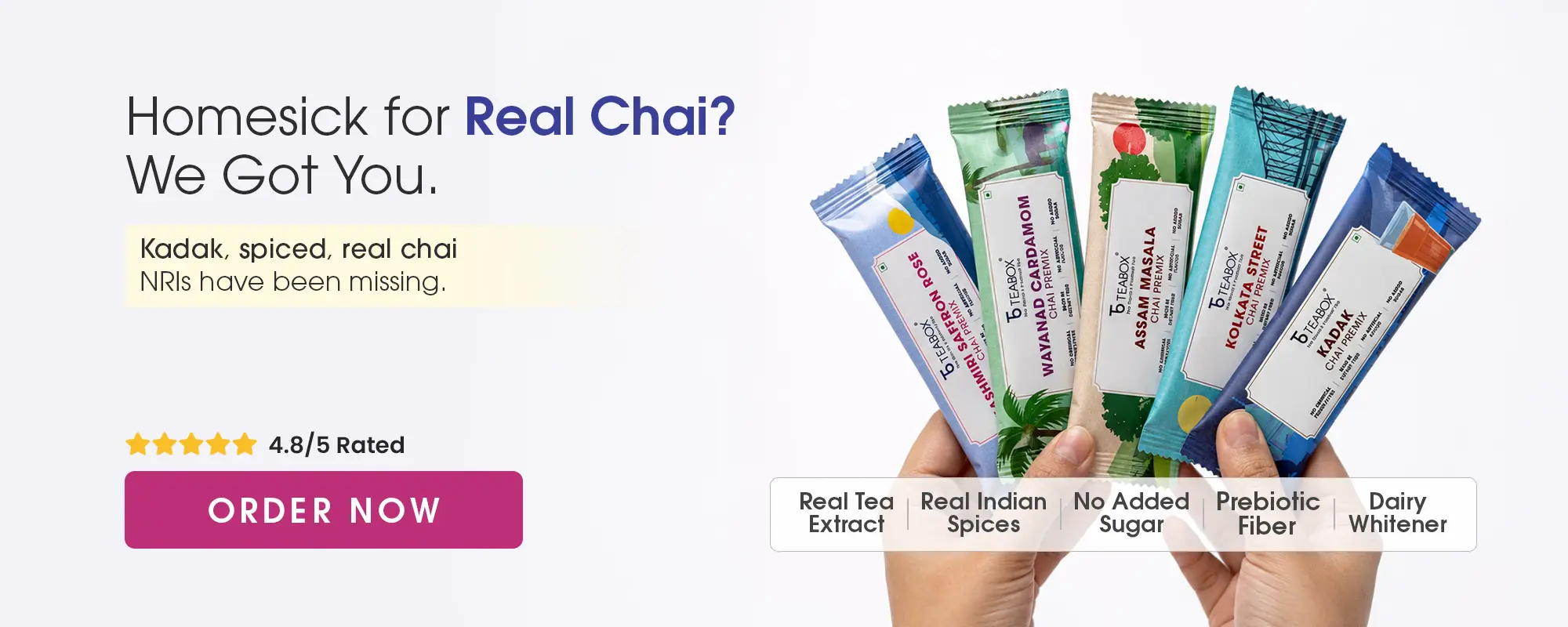 An advertisement for Teabox chai showing hands fanning out five different flavors of chai premix packets.