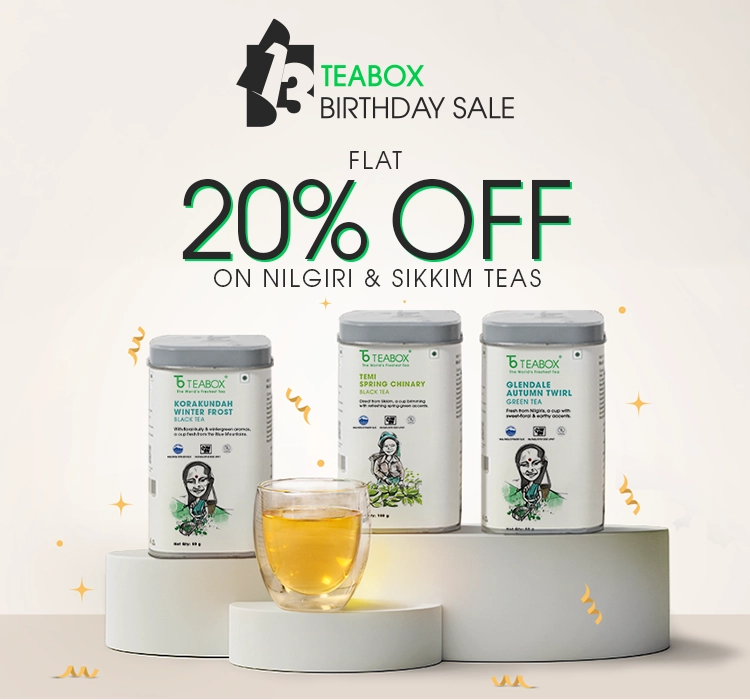 A promotional image for a Teabox birthday sale, featuring three tins of tea and a glass of tea.