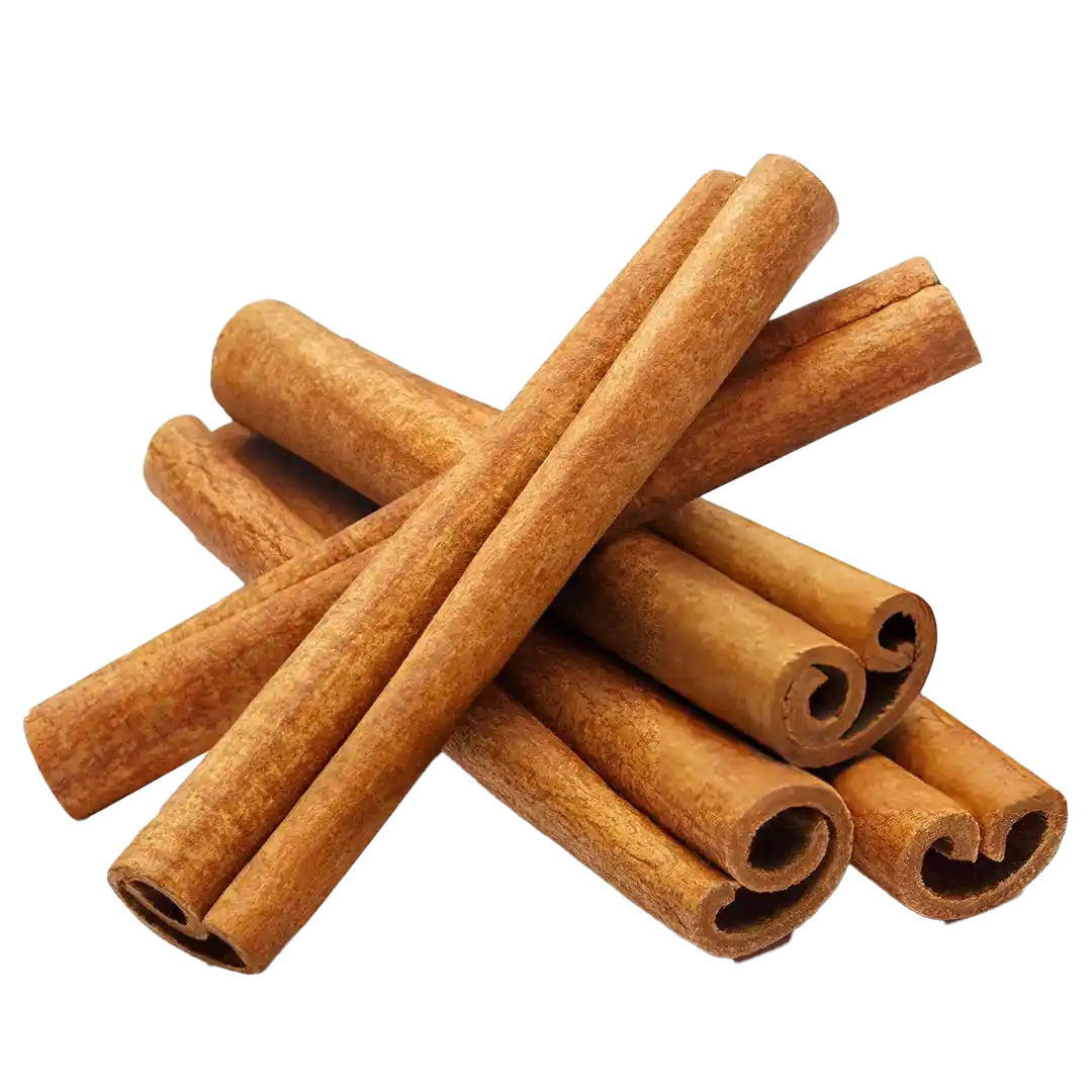 A pile of cinnamon sticks on a green background.
