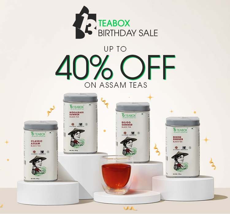 An advertisement for Teabox Birthday Sale, showing four canisters of Assam tea and a glass of tea.