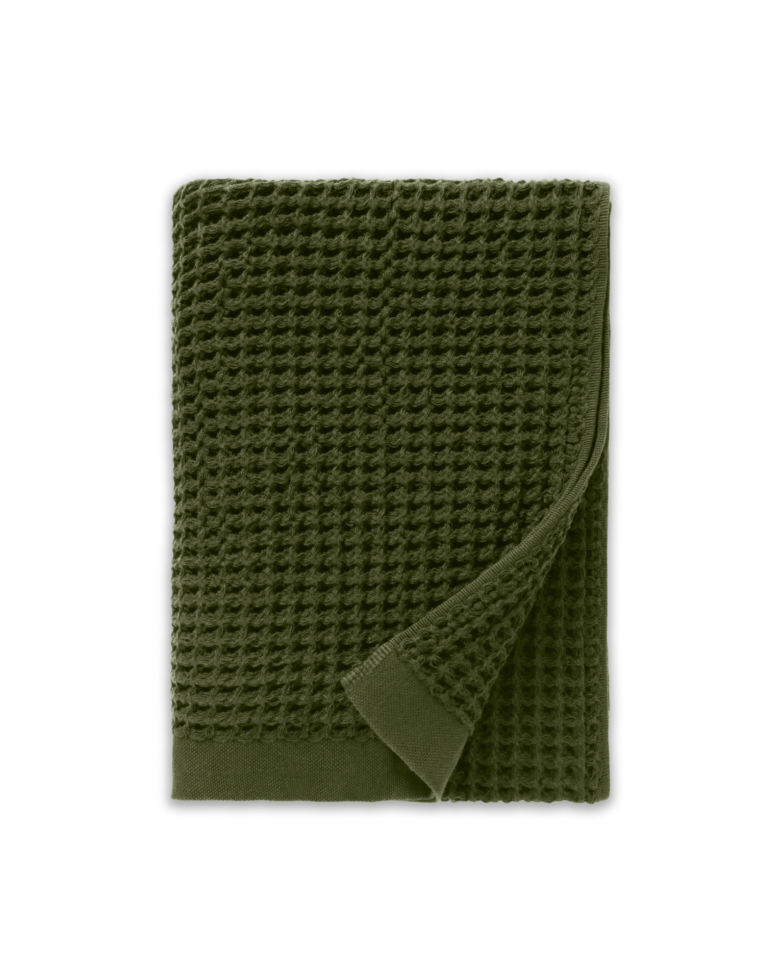A folded, dark green, waffle-weave towel with one corner turned back, against a white background.
