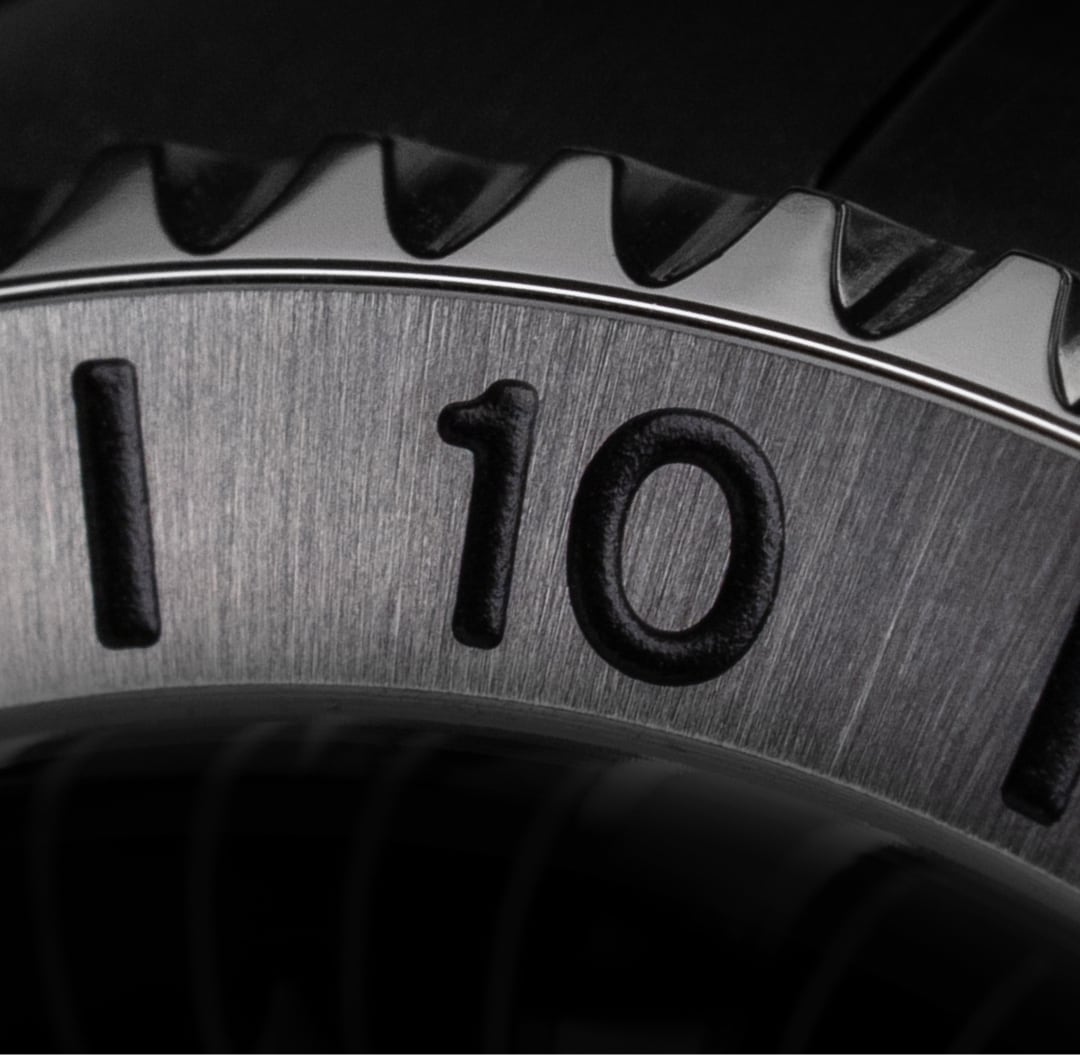 Open jacket with French flag colors laid on grass.