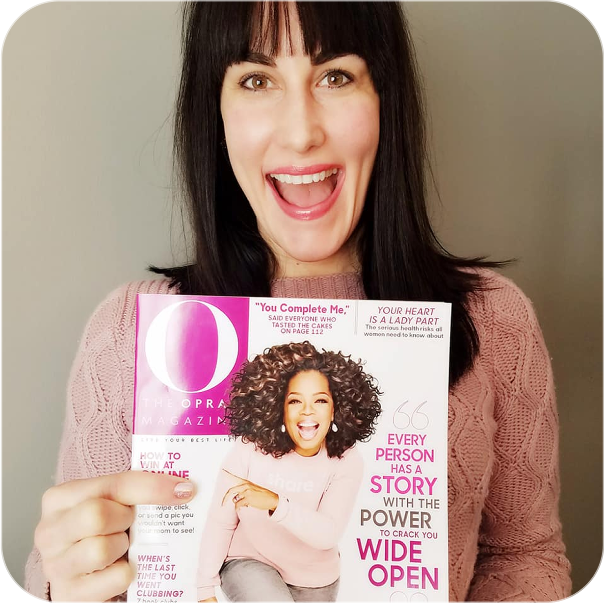 Excited woman holding O, The Oprah Magazine issue featuring Honey Cloudz in Female Founder Special edition.