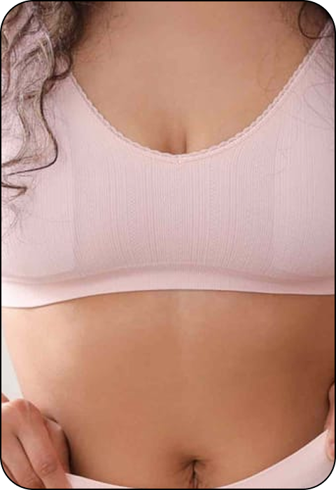Person wearing a light pink sports bra.