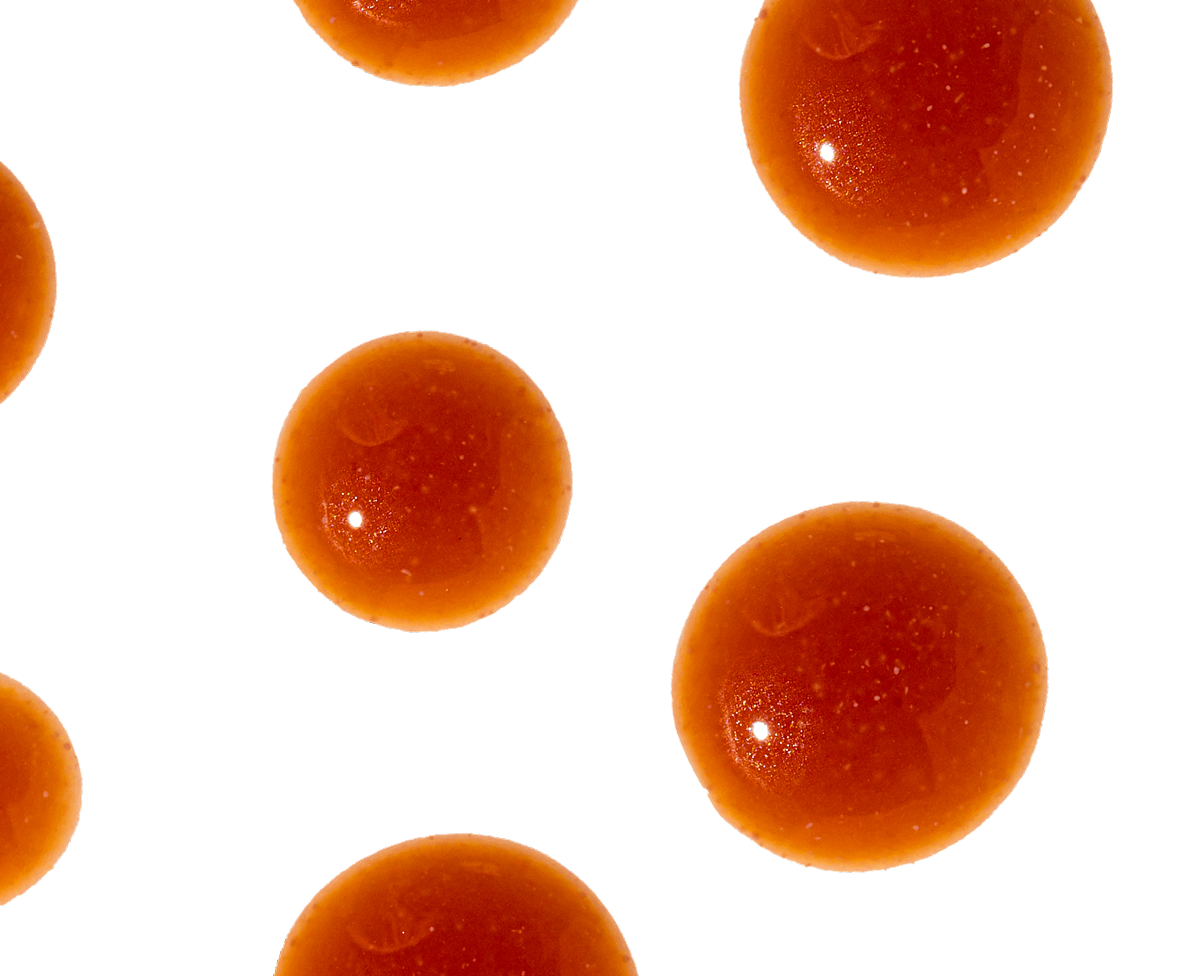 Orange spheres on a black background.