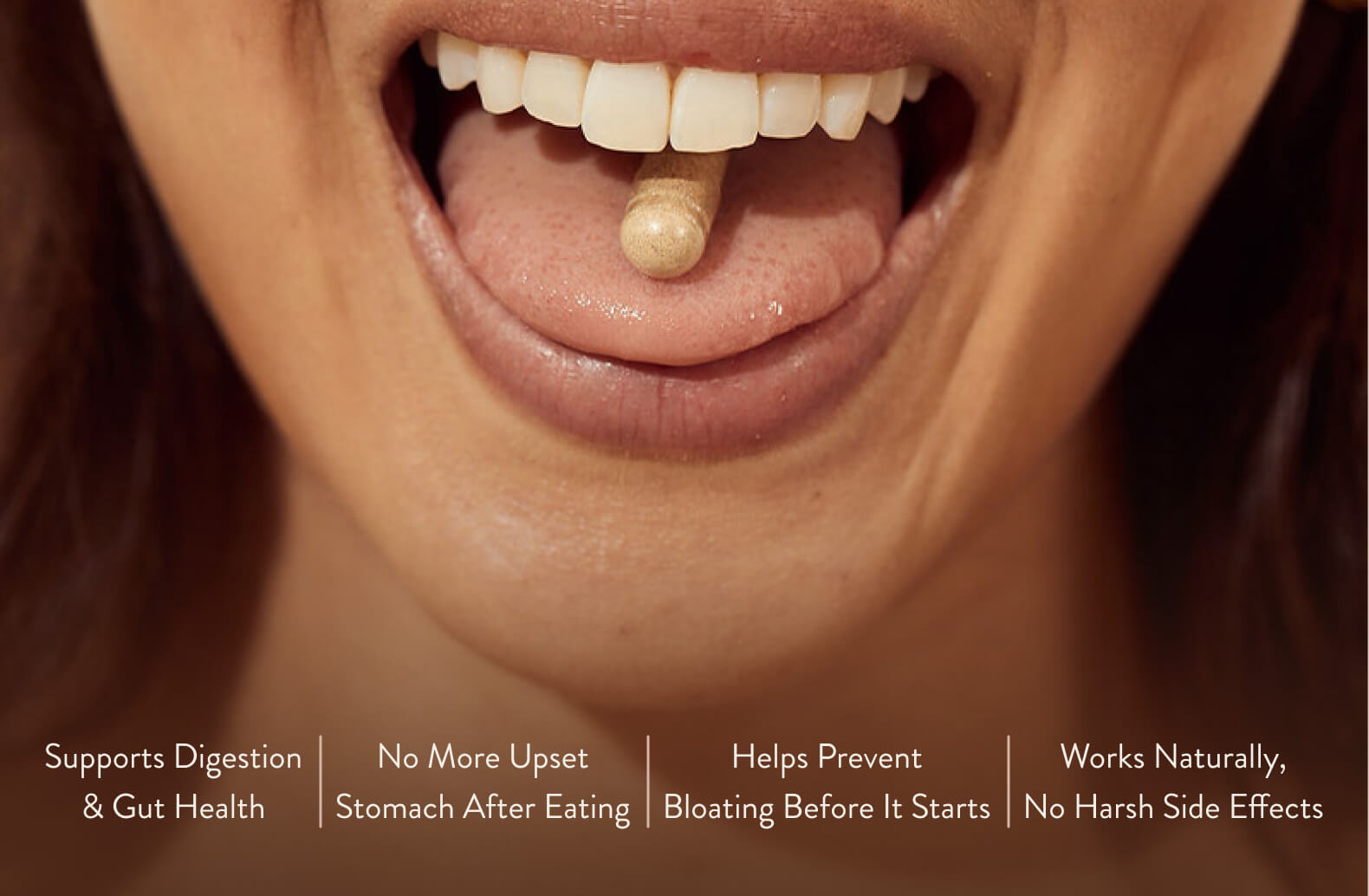 Close-up of a person with a pill on their tongue.