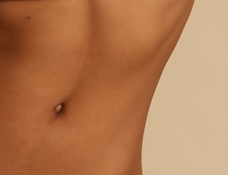 Close-up of a person's bare midriff and navel.