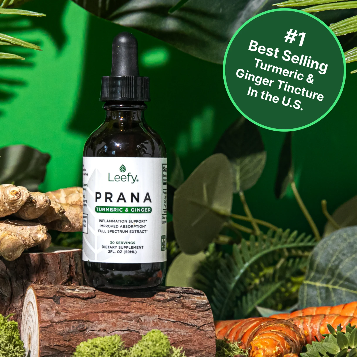 A bottle of Leefy Prana Turmeric & Ginger tincture on a log with fresh turmeric and ginger.
