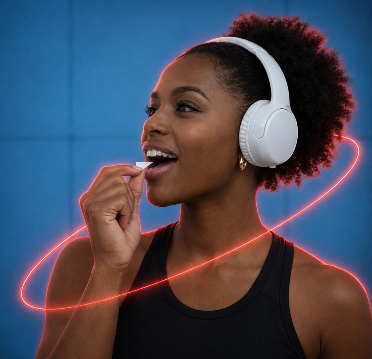 A woman wearing white headphones puts a piece of gum in her mouth against a blue background.