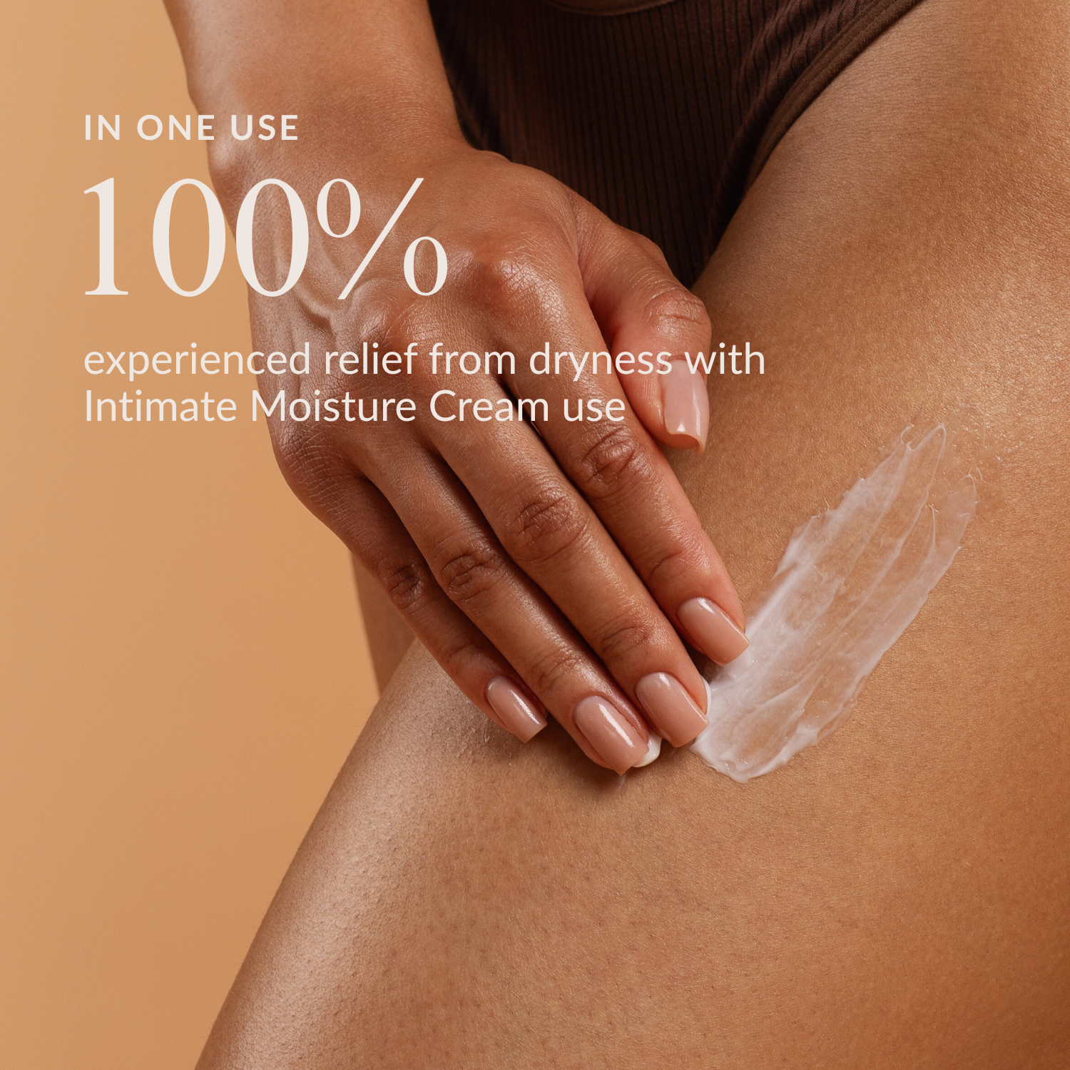 A person's hand applies a swipe of white cream to their thigh, with text about product benefits.
