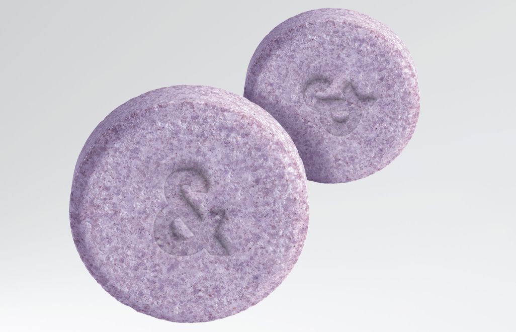 Two purple tablets with an ampersand symbol engraved.