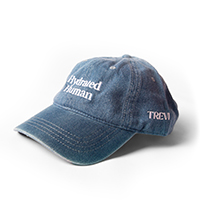 A blue denim-style baseball cap with 'Hydrated Human' and 'TREVI' embroidered in white text.
