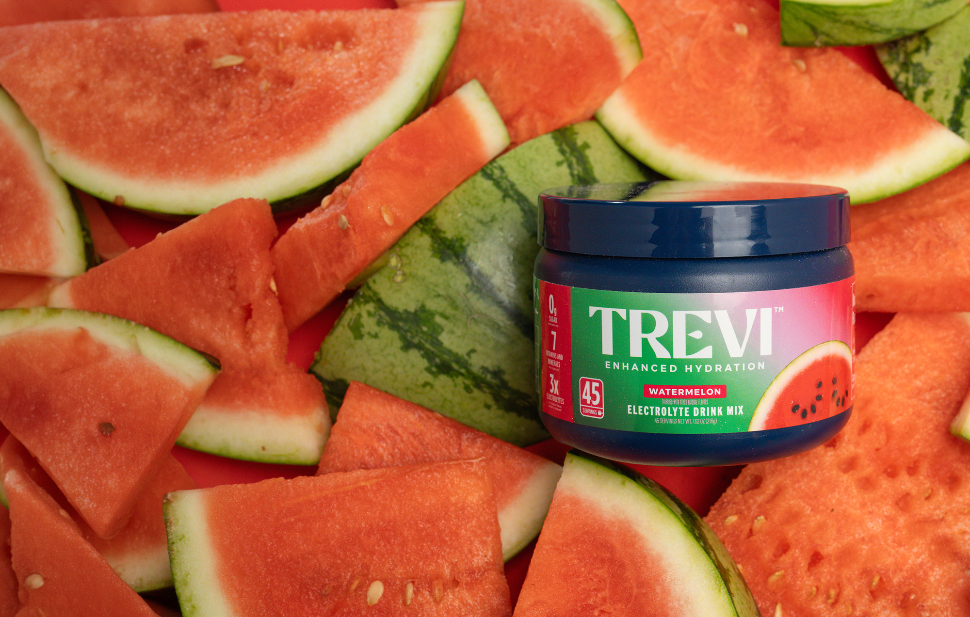 Trevi electrolyte drink mix package surrounded by lemons against a blue sky.