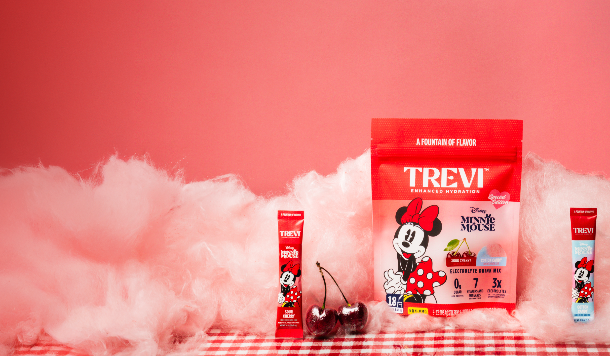 Trevi electrolyte drink mix package surrounded by lemons against a blue sky.