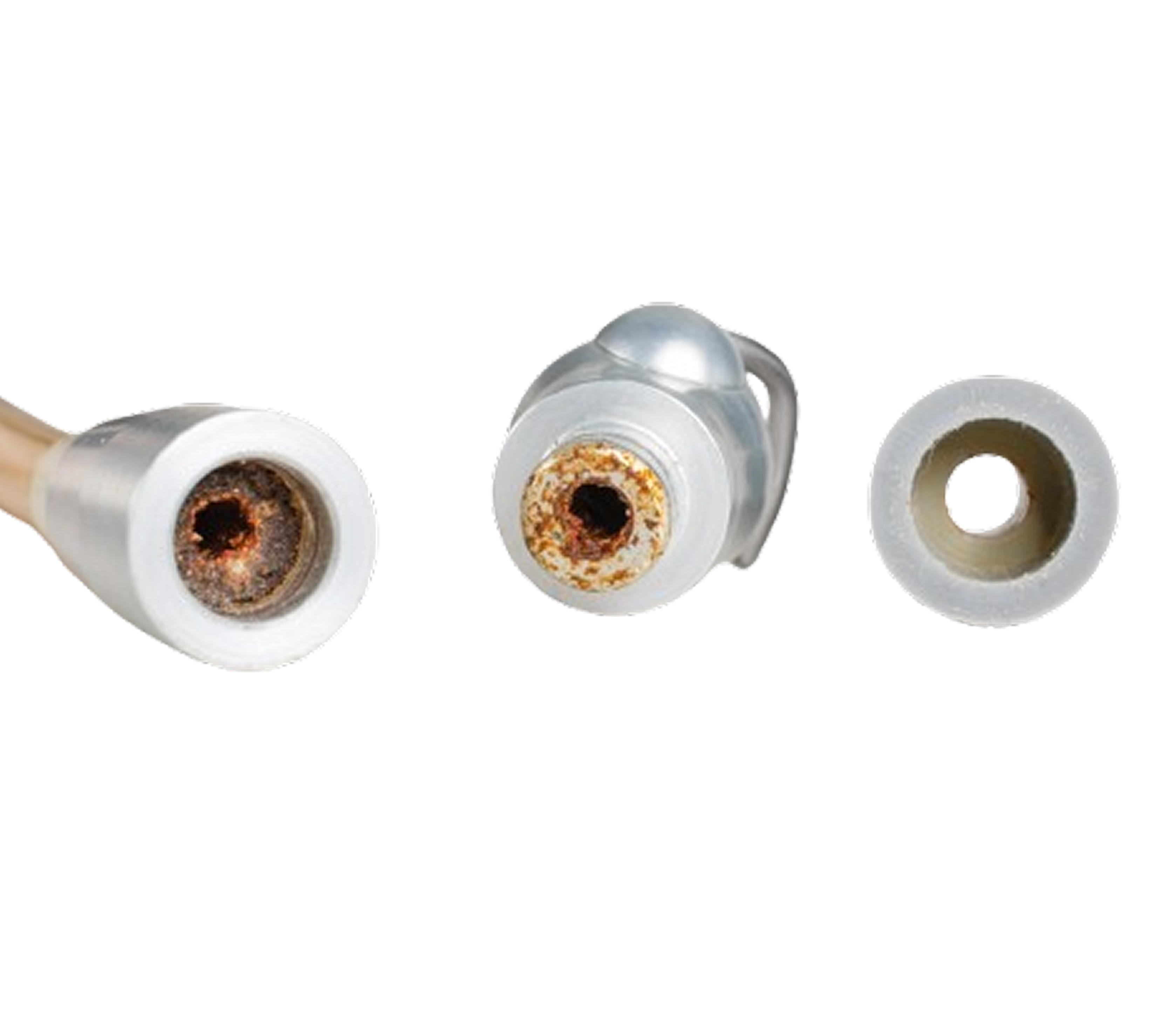 Three corroded metal nozzles with white plastic edges on a white background.