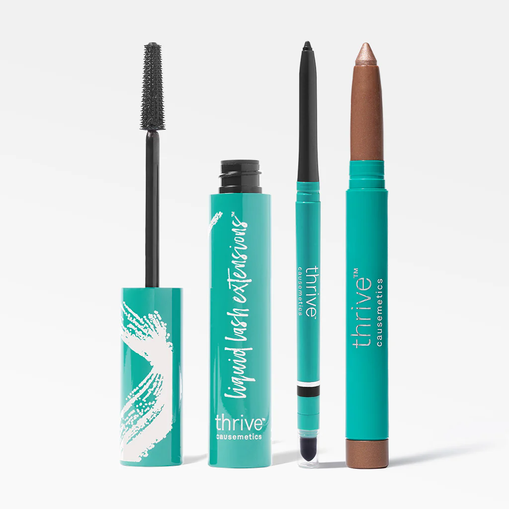 Three teal cosmetic products including mascara, eyeliner, and eyeshadow stick.