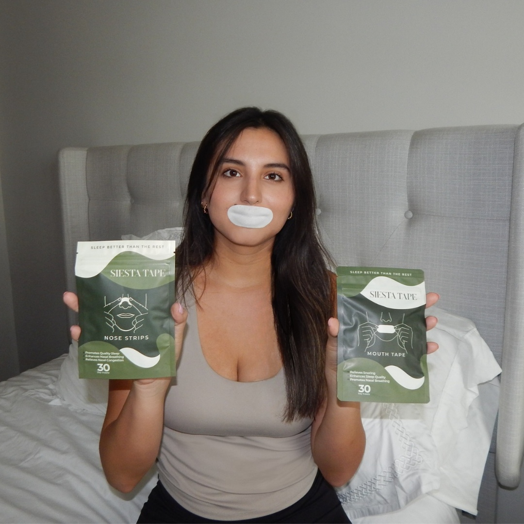 Person holding Siesta Tape boxes with a tape on their mouth, sitting on a bed.